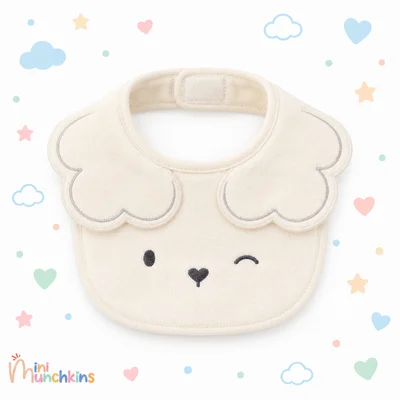 Babero crema · fotografía del catálogo de Mini Munchkins